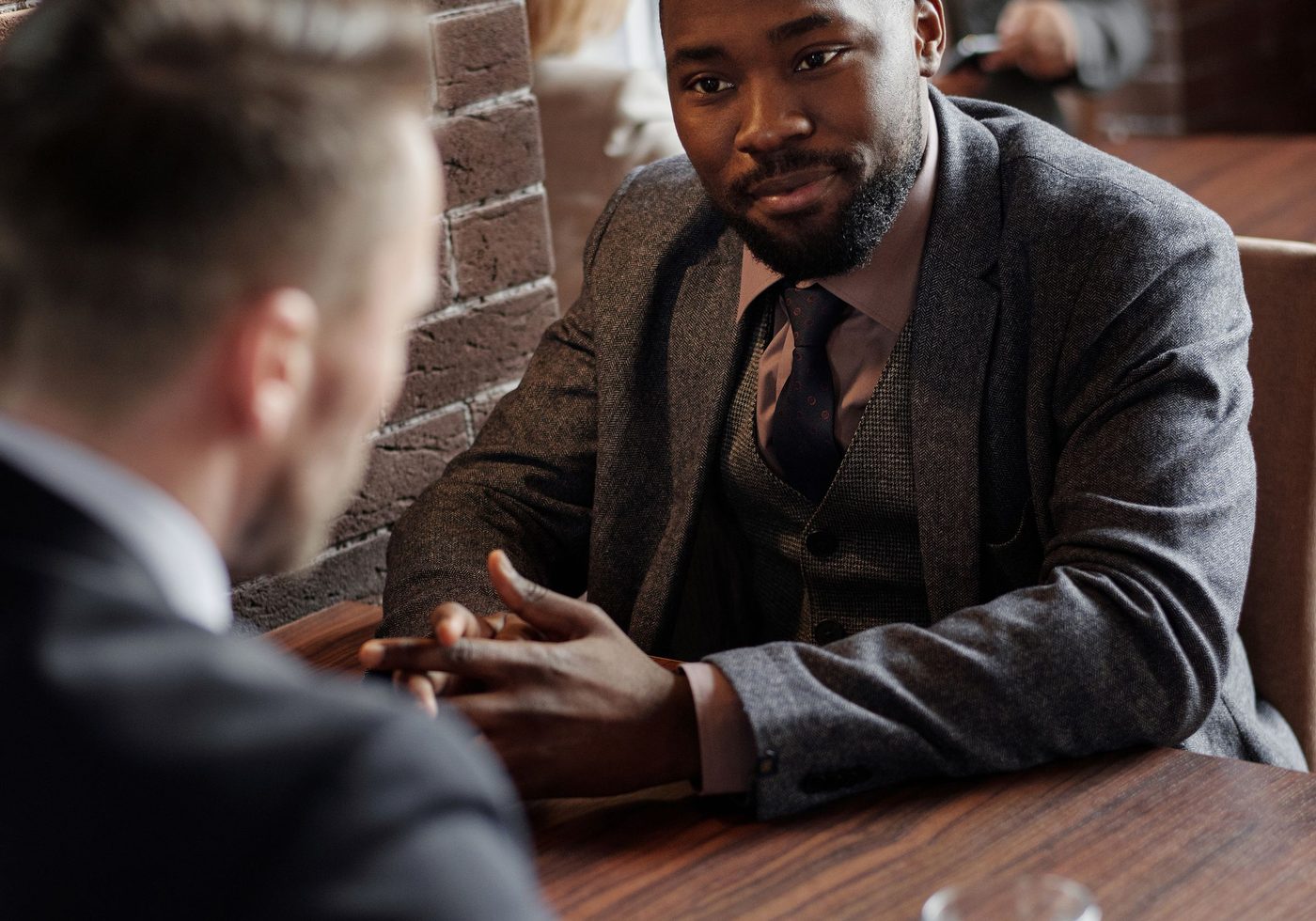 An accountant and an adviser talking across a table
