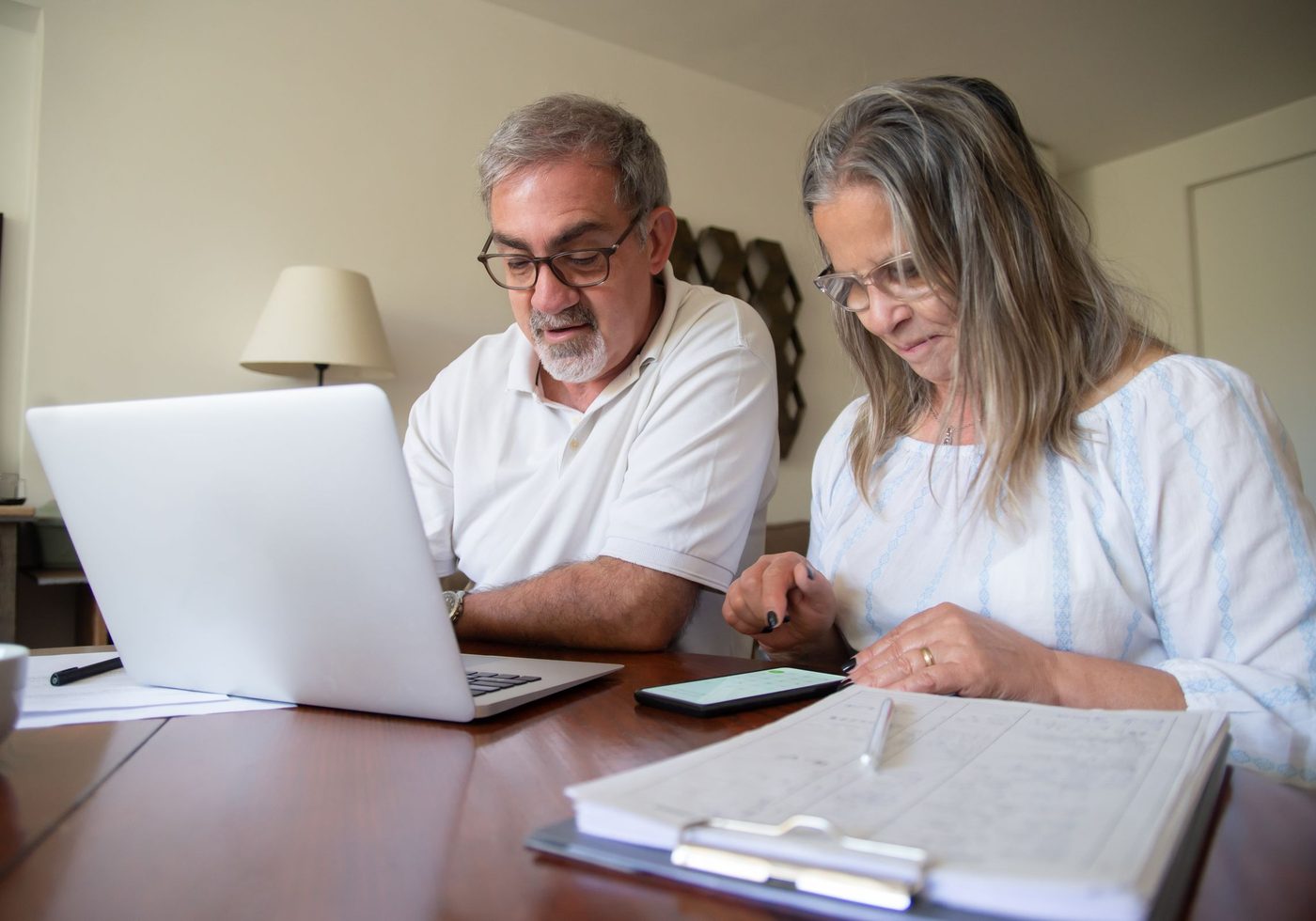 A couple reviewing their finances at home
