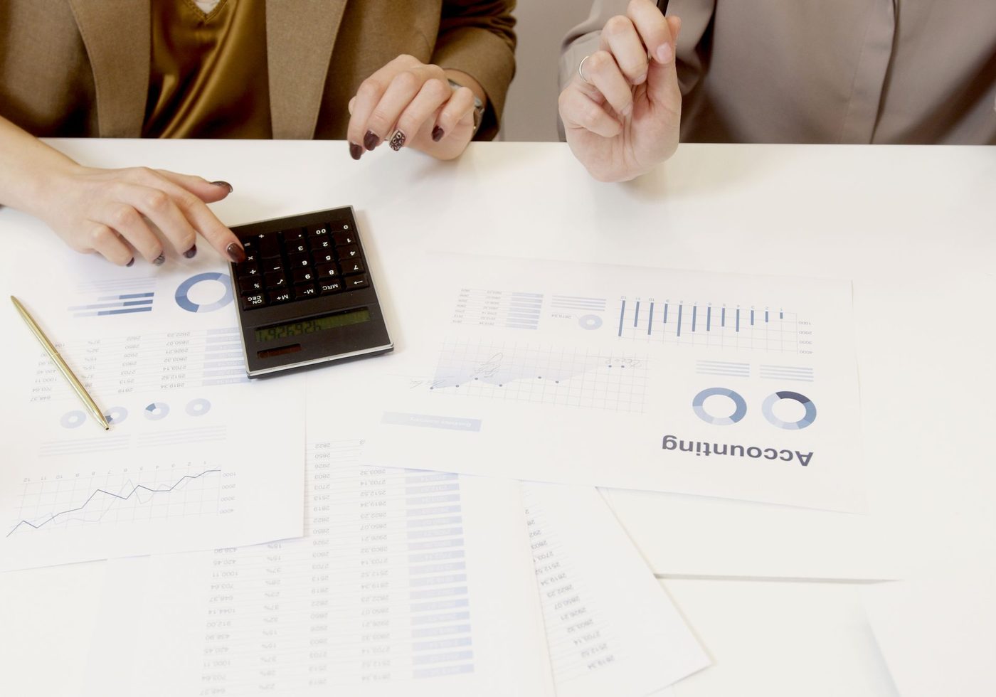 Client accounts and a calculator on a desk