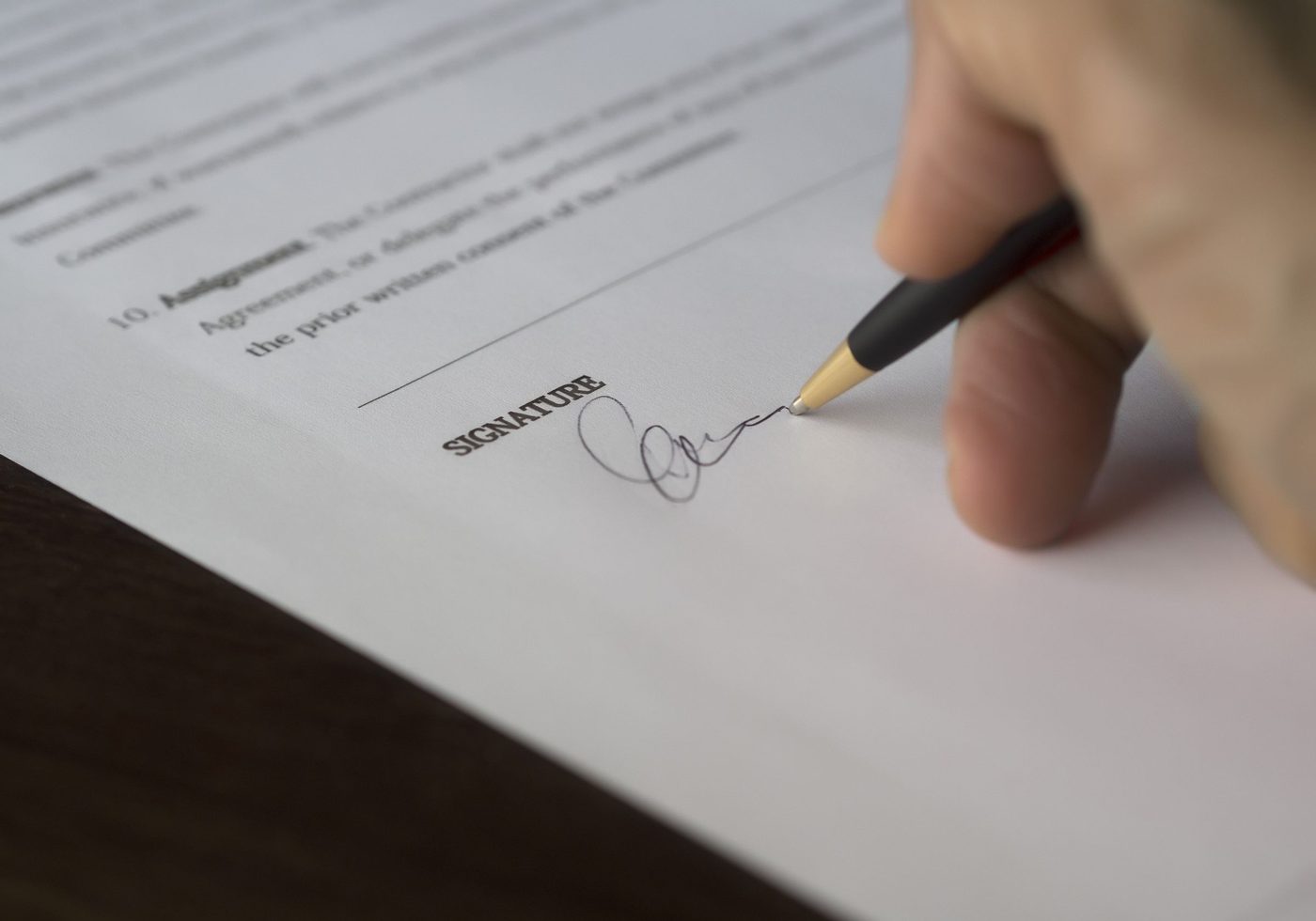 A client signing an agreement