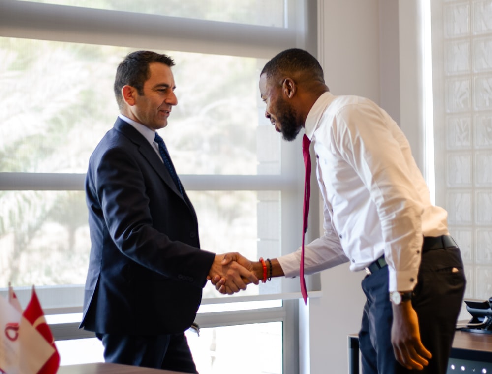 An accountant and an Equity & General adviser shaking hands on a partnership